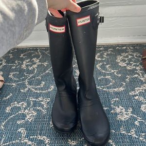 Used Hunter boots with tear